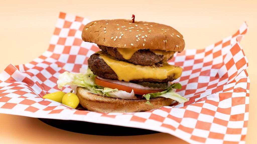 Double Cheeseburger · Sesame seed bun, 2 house-made gourmet patties, 2 slices of melted American cheese, lettuce, white onions, tomatoes, pickles, and our signature 1000 Island dressing.