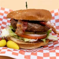 Bacon Burger · Sesame seed bun, house-made gourmet patty, crispy bacon, lettuce, white onions, tomatoes, pi...