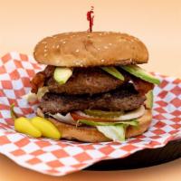 Double Bacon Avocado Burger · Sesame seed bun, 2 house-made gourmet patties, crispy bacon, fresh avocado, lettuce, white o...