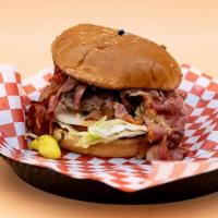 Pastrami Burger · Sesame seed bun, house-made gourmet patty, juicy pastrami,  lettuce, white onions, tomatoes,...