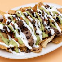 Nachos Supreme · Tortilla chips covered with the meat of your choice, nacho cheese, melted shredded cheese, r...