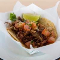 Classic Carnitas Taco · Authentic taco with carnitas on fresh-made corn or flour tortillas, served with fresh pico d...