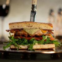Royal Club Sandwich · grilled chicken with cheddar, nitrate free bacon, arugula, tomato, tarragon mayo, served on ...