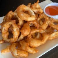 Fried Calamari · Calamari lightly battered and fried, served with sweet and sour sauce.