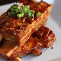 Bbq Ribs · Tender pork ribs grilled with bbq sauce.
