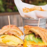 Croissant Sandwich · croissant, egg, american cheese, bacon, avocado, tots