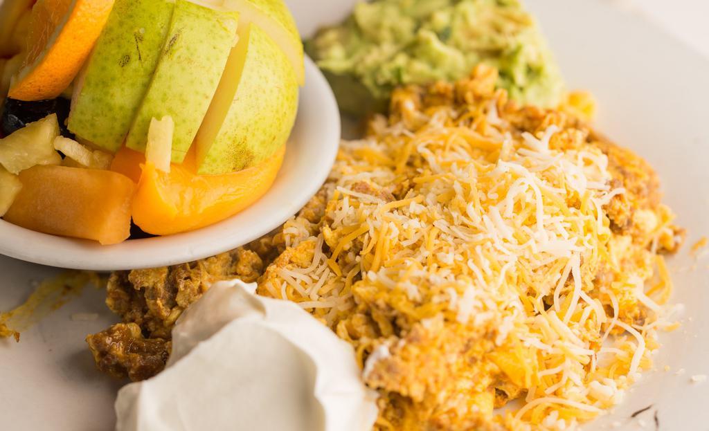 Chorizo Scramble With Cheese · With sour cream and guac. and potatoes and tortillas.