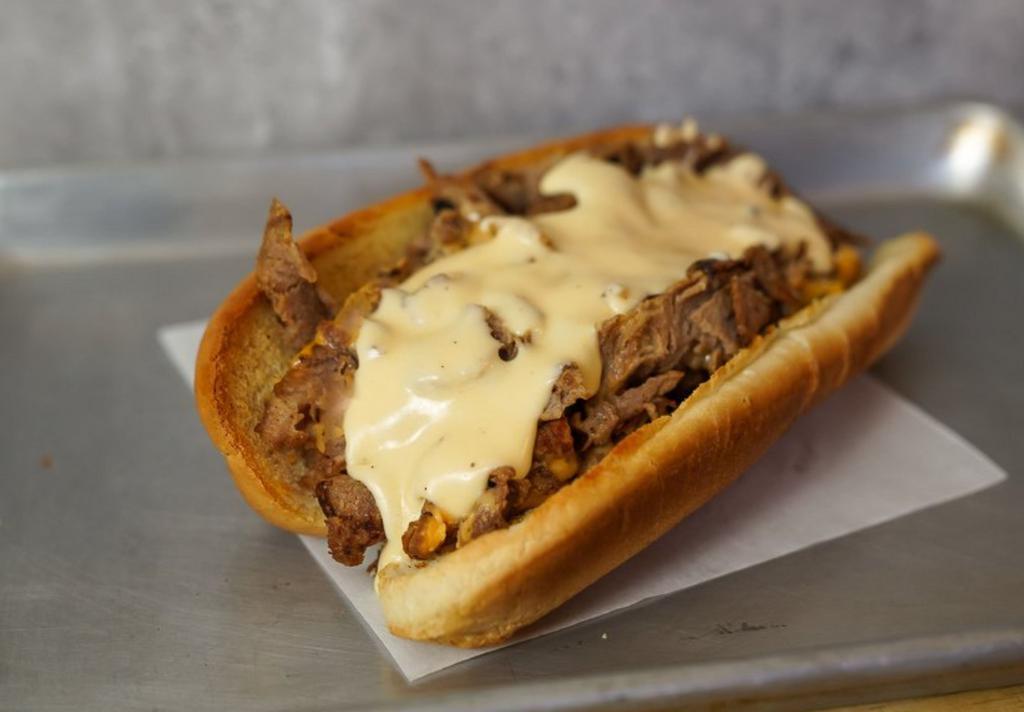 Classic Philly Cheesesteak · Classic Philly cheesesteak loaded with grilled steak and melted cheese on a toasted hoagie roll