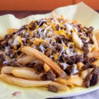 Super Fries · Choice of meat, cheese, sour cream & guacamole.