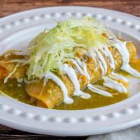 Chicken Enchiladas · Chicken Rolled in fresh corn tortillas topped with salsa enchilada, cheese and lettuce.
