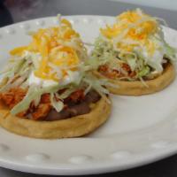 2 Sopes · Choice of Meat, beans, sour cream, lettuce, and cheese.