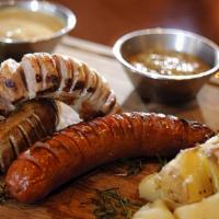 Tour De Sau'Sage · Nuremberg bratwurst, pork andouille & savory Italian all braised in local IPA then grilled t...