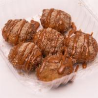 Churro Fried Oreos · 6 Deep Fried Oreo covered in a churro cinnamon sugar, topped with a dulce de leche or chocol...