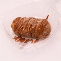 Churro Fried Twinkie  · A Deep Fried twinkie covered in a churro cinnamon sugar, topped with a dulce de leche or cho...
