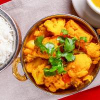 Aloo Gobi (Potato & Cauliflower) · Potatoes and cauliflower cooked with onion and tomato sauce with himalayan herbs and spices.