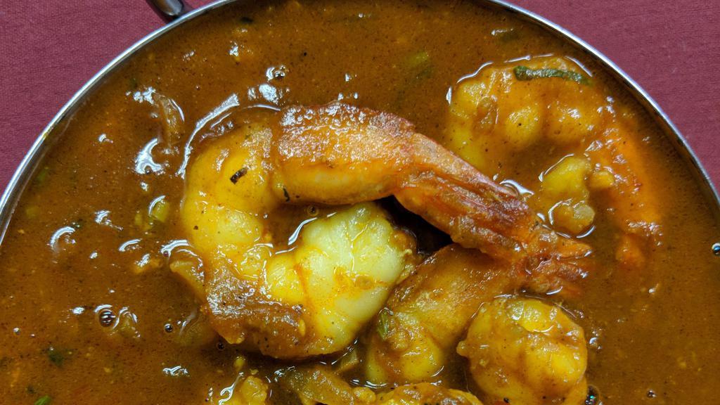Shrimp Curry · Shrimps cooked in onion and tomato sauce with Himalayan herbs and spices.