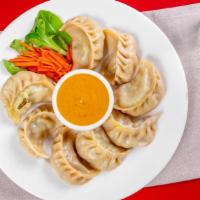 Chicken Momo (8 Pieces) · Steamed dumplings filled with minced chicken, onion, cilantro and Himalayan herbs and spices...