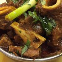 Goat Curry (Bone In) · Serve with white basmati rice or butter naan bread. Bone in goat meat cooked with Himalayan ...
