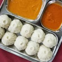 Vegetables Momo (8 Pieces) · Steamed dumplings filled with minced cabbage, fresh spinach, cashew nuts, onion, cilantro, g...