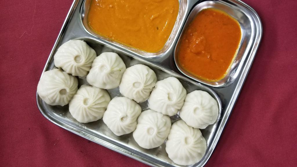 Vegetables Momo (8 Pieces) · Steamed dumplings filled with minced cabbage, fresh spinach, cashew nuts, onion, cilantro, green onion and Himalayan herbs and spices. Serve with special Himalayan sauce.