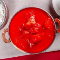 Chicken Tikka Masala · Boneless chicken breast cubes cooked in a creamy onion and tomato sauce with himalayan herbs...