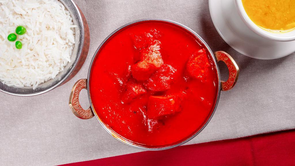Chicken Tikka Masala · Boneless chicken breast cubes cooked in a creamy onion and tomato sauce with Himalayan herbs and spices.