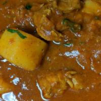 Chicken Vindaloo · Boneless chicken, potato, onion and tomato gravy cooked in Himalayan herbs and spices, vineg...