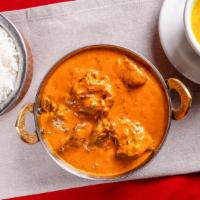 Lamb Korma · Boneless lamb cooked with coconut milk, creamy sauce, and Himalayan herbs and spices.