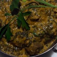 Lamb Saag · Boneless lamb and spinach cooked with onion, tomato and creamy sauce with Himalayan herbs an...