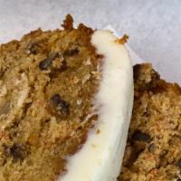 Carrot Cake · Slice of carrot cake loaf with icing