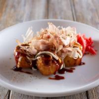 Takoyaki · Octopus fritter topped with tangy Takoyaki sauce, mayo, bonito flakes, aonori seaweed, red g...