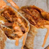 Cajun Burrito · 3 sunny side up eggs, cajun bier-cheese sausage, white american cheese, caramelized onions, ...
