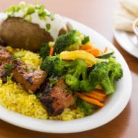 Steak Skewer Plate · Marinated steak, grilled to perfection (served medium temperature), on a bed of rice with yo...