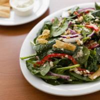 Spinach Salad · Spinach, red onions, red bell peppers, Feta cheese, candied almonds & pita chips, tossed in ...