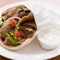 Gyro Sandwich · Sliced gyro meat, romaine lettuce, tomatoes and red onions, topped with vinaigrette dressing...
