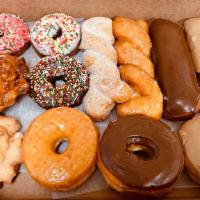A Dozen Mixed Donuts · Assortment of 12 donuts.
Normally Includes: 
4 long raised donuts ( chocolate or maple bars ...
