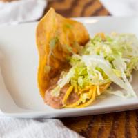 Bean Taco · Chef-griddled stone ground corn tortilla, cheese, lettuce, Parmesans dusted.