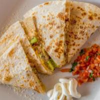 Stuffed Quesadilla  · Grilled ﬂour tortilla stuffed with chicken, bacon, avocado, cheese, pico and a chipotle sauc...
