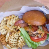 Smash Burger & Waffle Fries (Vegan Patty Option) · 1/3lb ABF & hormone free beef smashed to perfection, lettuce, tomato, onion, pickles, specia...