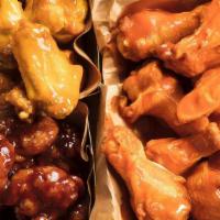 30 Pc Classic Wings · Thirty Classic Bone-In Chicken Wings hand-tossed in your choice of 3 sauces or rubs.