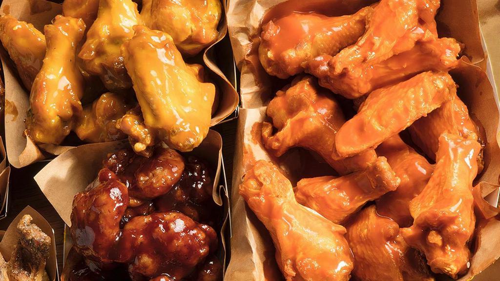 30 Pc Classic Wings · Thirty Classic Bone-In Chicken Wings hand-tossed in your choice of 3 sauces or rubs.