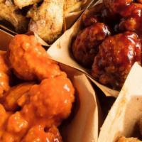 30 Pc Boneless Wings · Thirty Boneless Chicken Wings hand-tossed in your choice of 3 sauces or rubs.