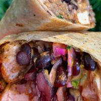 Fish Burrito · A flour tortilla, battered vegan fish, mexican rice, black beans, pico de gallo, chipotle cr...