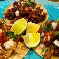Three Taco Plate · 3 tacos. Your choice of protein, cilantro, onions, salsa and lime. COMES WITH BEANS AND RICE.