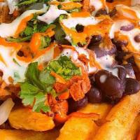 Loaded Fries · Crispy fries covered in our queso (dairy & nut free), beans, plant based meat of your choice...