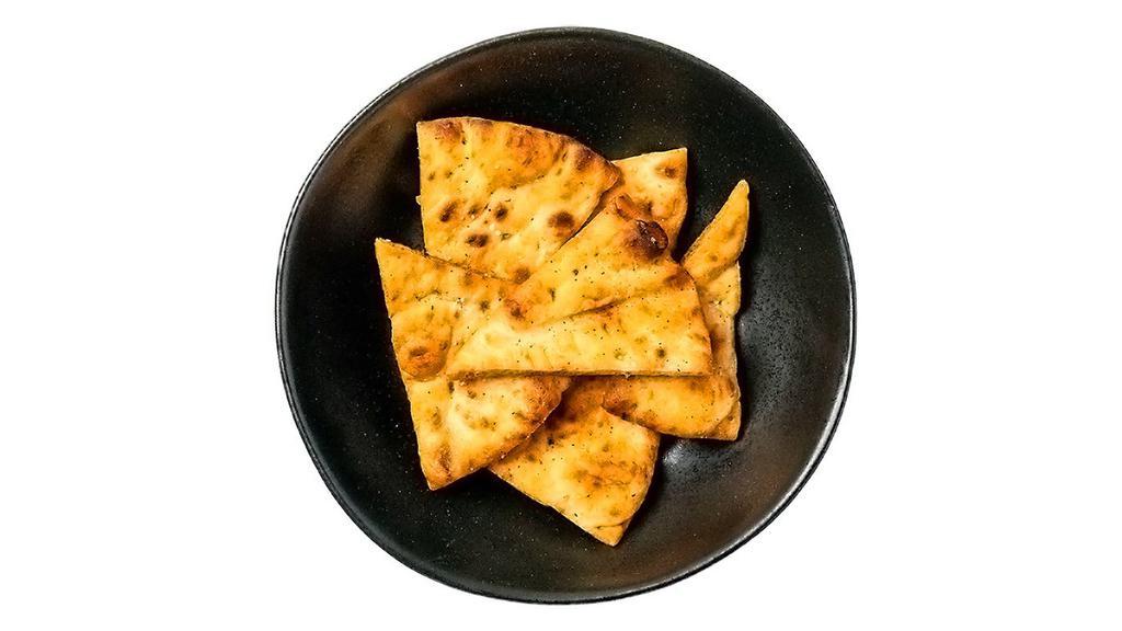 Pita Chips · Made in-house in small batches, our pita chips are meant for big dipping. Contains sesame.