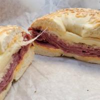 Reuben · Hot corned beef, Russian dressing, sauerkraut and melted Swiss.