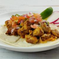 Chicken Tikka Taco · Grilled chicken tikka, Spanish rice, pico de gallo, and mint escabeche crema - Served on a f...