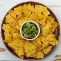 Chips & Guacamole · Vegan.  Tortilla chips, hass avocados, red onions, serrano chiles, lime, pistachios, cilantro