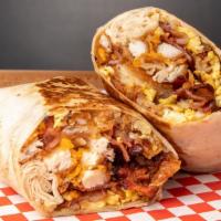 La Breakfast Burrito · Scrambled eggs, Bacon, breakfast sausage. Tater tots and cheddar cheese wrapped in a flour t...